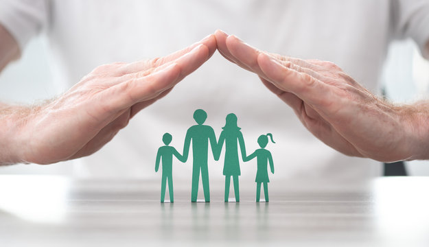Image of a family protected by hands.